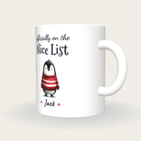 Personalised Christmas Jumper Penguin Mug, On The Nice List, three-quarter view