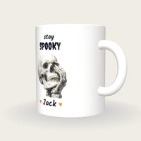 Personalised Skull Hand Mug, Stay Spooky, three-quarter view