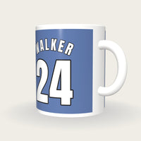 Personalised Light Blue and Navy Basketball Jersey Mug, three-quarter view