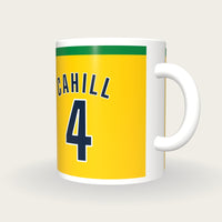 Personalised Gold and Green Football Shirt Mug, three-quarter view