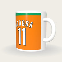Personalised Orange and Green Football Shirt Mug, three-quarter view