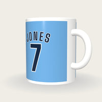 Personalised Sky Blue and Navy Football Shirt Mug, three-quarter view