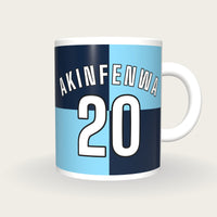 Personalised Sky Blue and Navy Quarters Football Shirt Mug, front