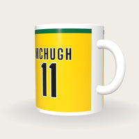 Personalised Gold and Green GAA Jersey Mug, three-quarter view
