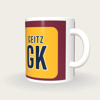 Personalised Maroon and Gold Netball Bib Mug, three-quarter view