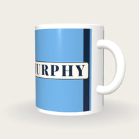 Personalised Sky Blue with Navy Braces Jockey Silks Mug, three-quarter view